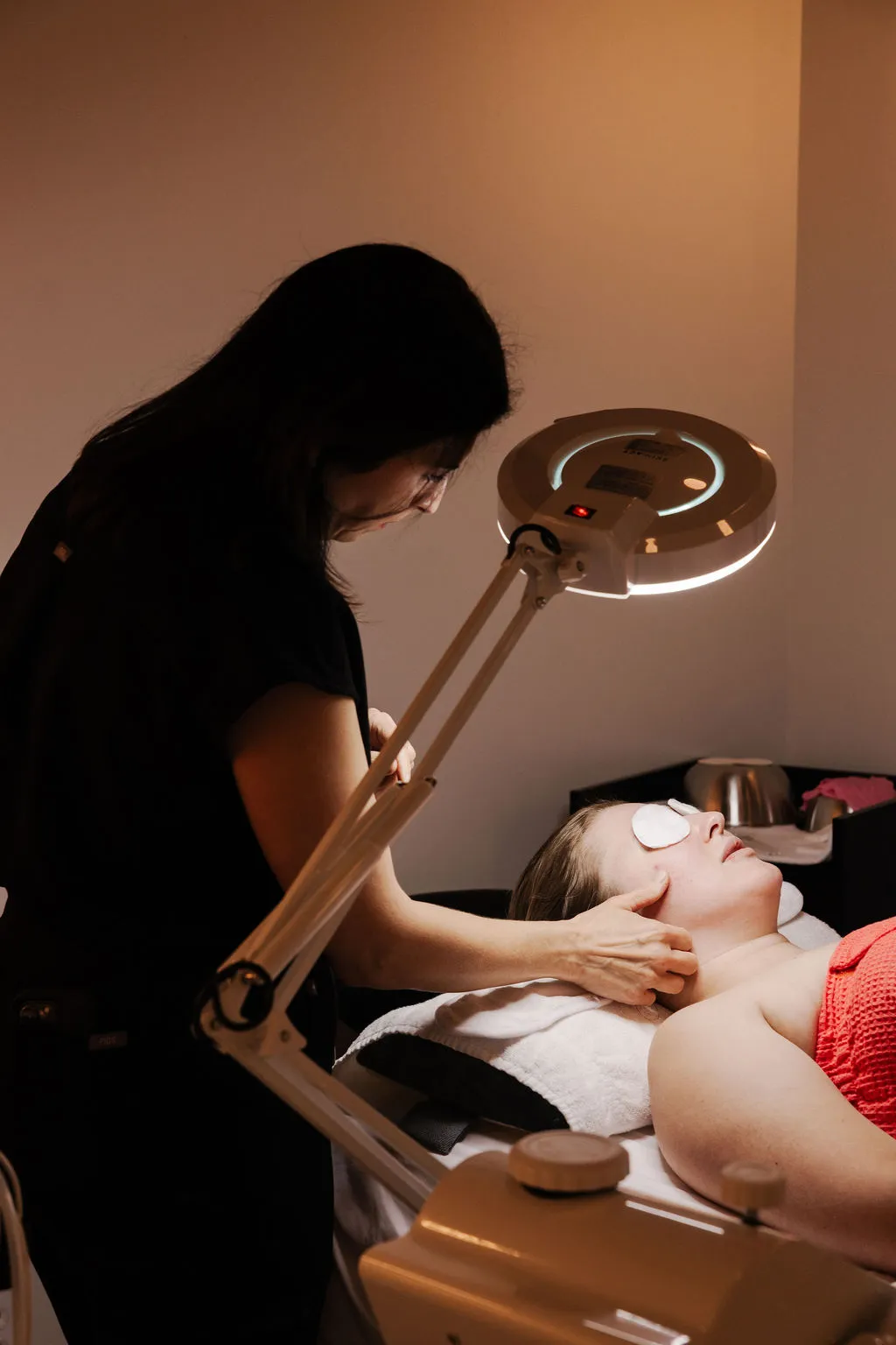 Satisfied client showcasing rejuvenated skin after laser treatment at New Beauty Medical Aesthetics, reflecting successful results